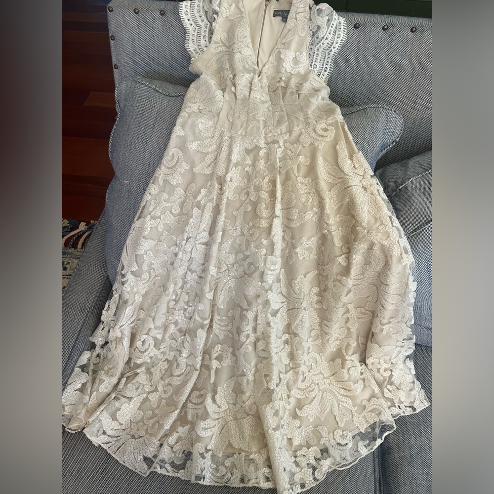 Gorgeous off white dress with lace. There is a lovely shimmer feel.